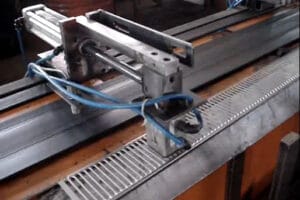 Pneumatic magnetic gripper with a dual air intake system for precise material handling.