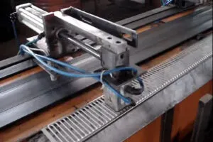 Pneumatic magnetic gripper with a dual air intake system for precise material handling.