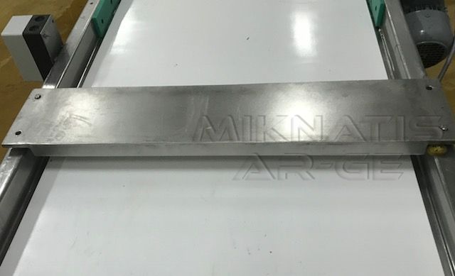 Suspended Magnetic Plate - Positioned above a belt conveyor in operation