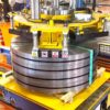 Electro Permanent Lifters - Securely lifting heavy metal sheets in industrial setting.